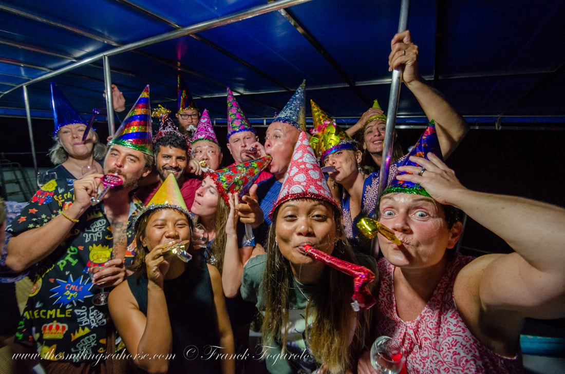 scuba divers celebrating new year in thailand