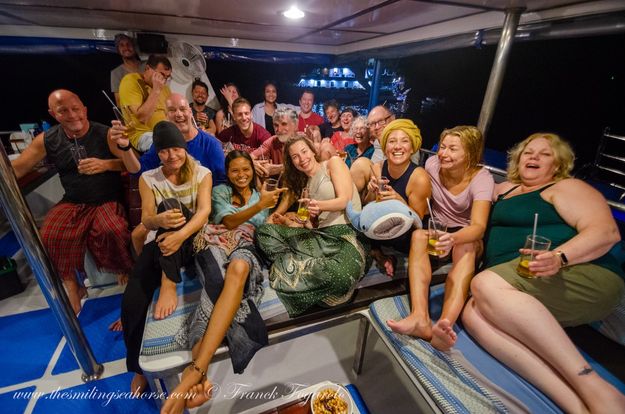 fun group photo on a thai liveaboard in similan islands