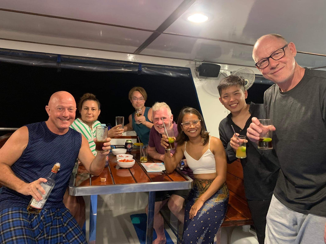 group of divers on a liveaboard