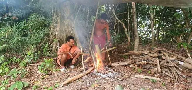 dinner cooked on the fire in minute made bamboo pots and tools